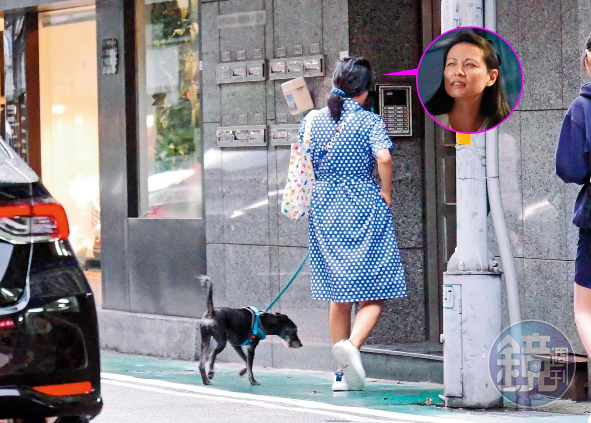 9/27 陳孝萱的穿著輕便，遛狗回到她台北市東區的華廈。