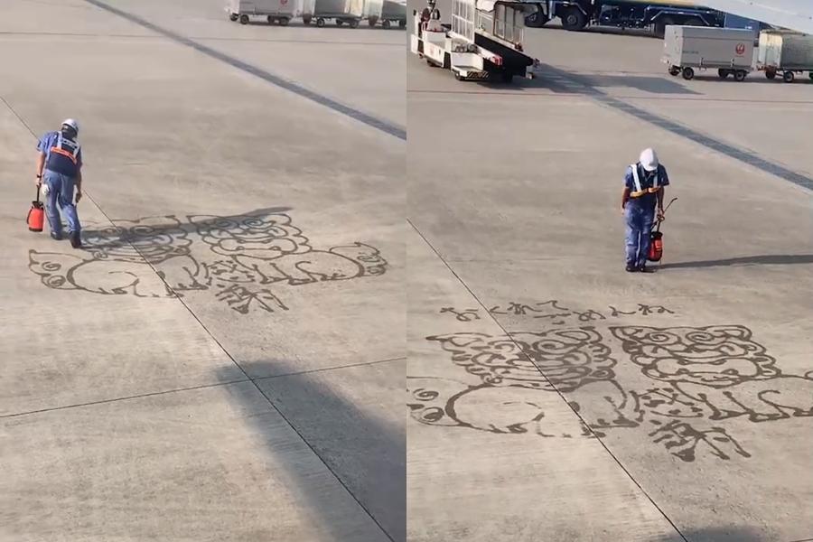 那霸機場的地勤用水槍畫下兩隻風獅爺，還對旅客行禮致意。（翻攝自@kanetomo0331 Twitter）